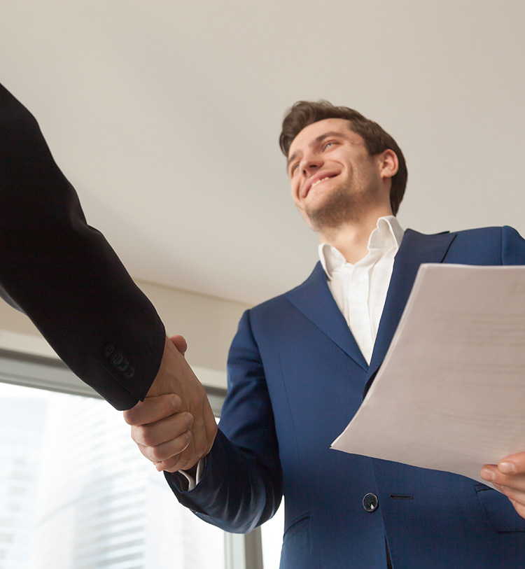 smiling company manager welcoming client in office smiling company manager welcoming client in office